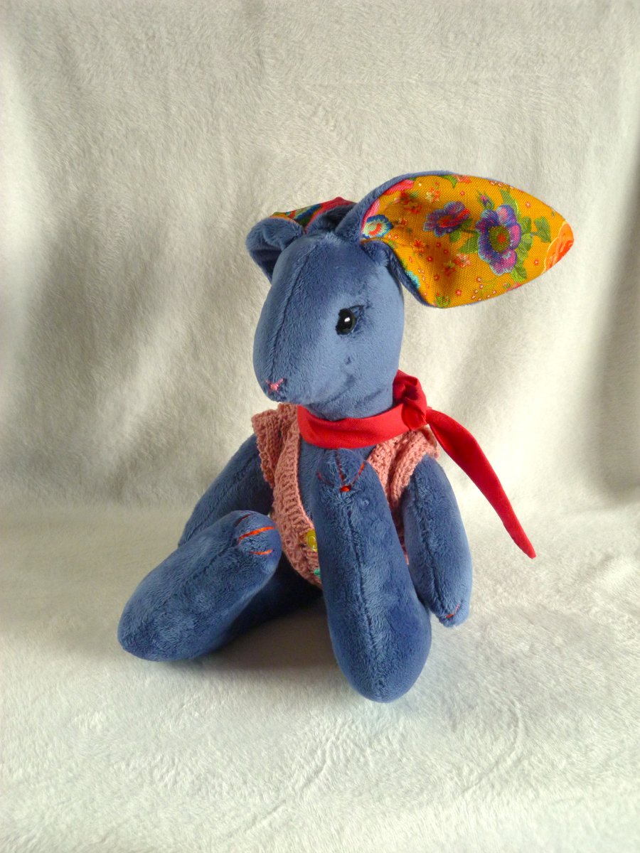 Bluebell, a 16" plush unjointed rabbit with neckerchief and knitted waistcoat.