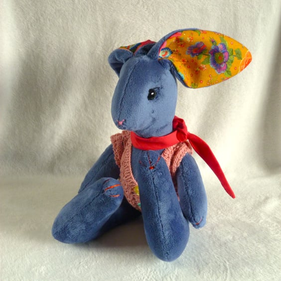 Bluebell, a 16" plush unjointed rabbit with neckerchief and knitted waistcoat.