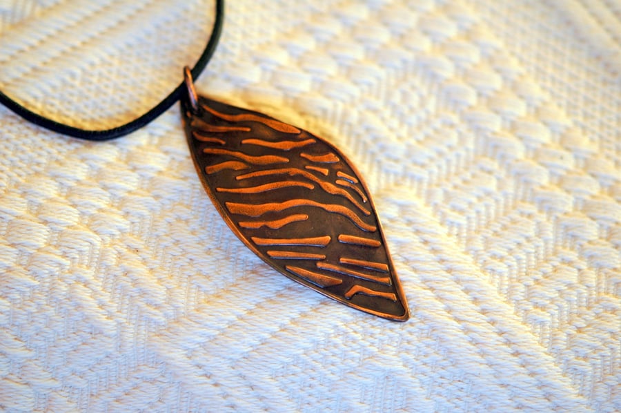 Copper leaf pendant imprinted with a tiger-striped pattern,  P47