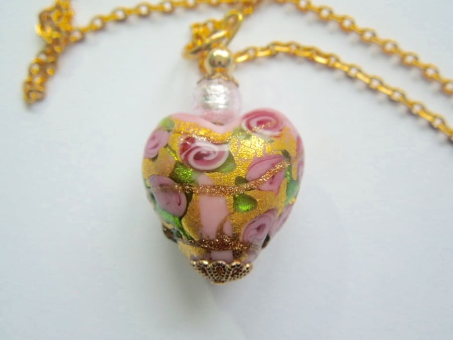 Pink and gold Murano glass heart pendant with gold chain.