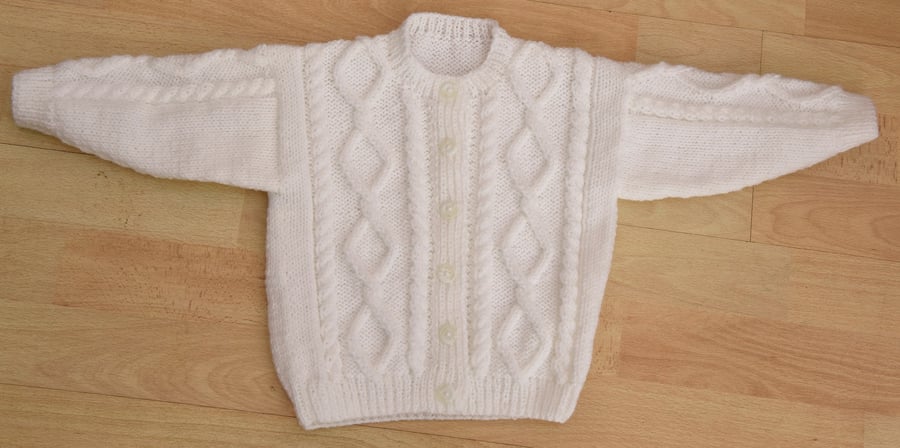 white  hand knitted baby cardigan to fit 6 to12 months aran style