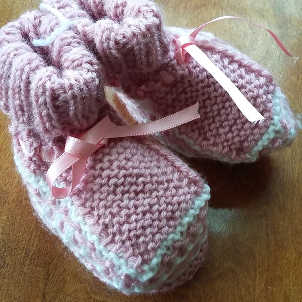 Pink bootees, hand knitted