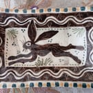 Square slip ware dish with hand painted hare