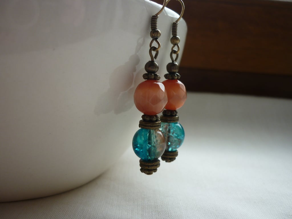 TEAL, ORANGE, BROWN AND ANTIQUE BRONZE DANGLE EARRINGS.