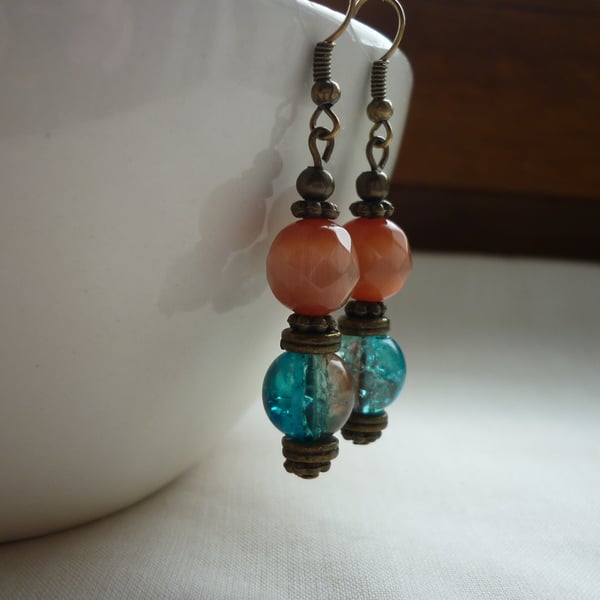 TEAL, ORANGE, BROWN AND ANTIQUE BRONZE DANGLE EARRINGS.