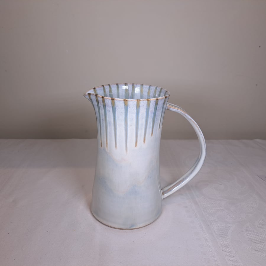 LARGE HAND MADE CERAMIC JUG - glazed in off white with green run decoration