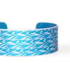 Swallow pattern aluminium cuff blue
