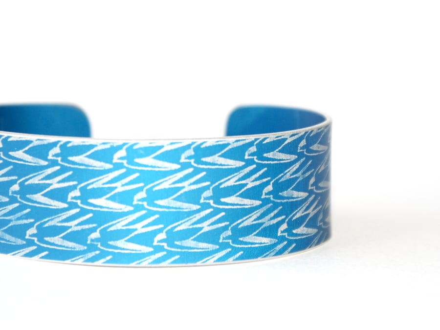 Swallow pattern aluminium cuff blue