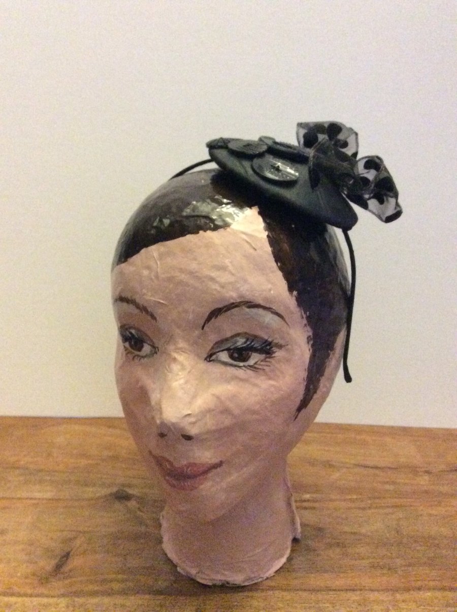 Black fascinator with spotty bow and Art Deco buttons 