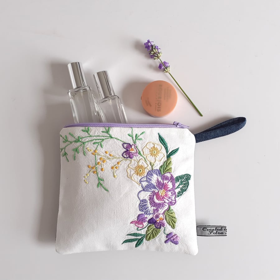 Make up bag or purse upcycled in vintage floral embroidery and denim.