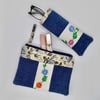 Glasses case and make up bag in denim with vintage embroidery.