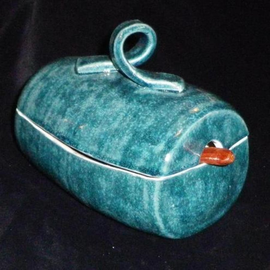 Handthrown butter dish.