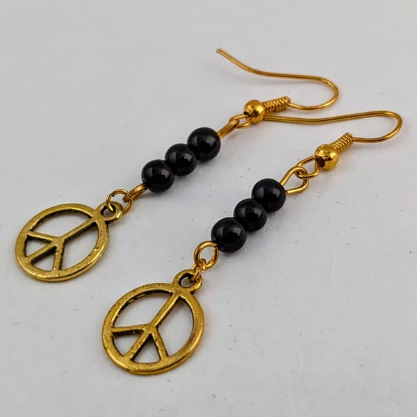 Black and gold peace sign earrings