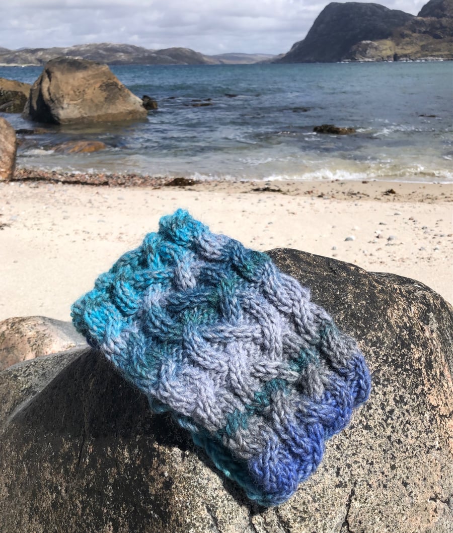 Hand knitted, lined headband featuring Celtic design 