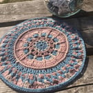 Crochet Plant Mat in calming beach shades
