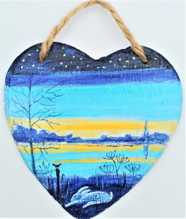 sleepy hare snoozing by a lake hand painted on slate