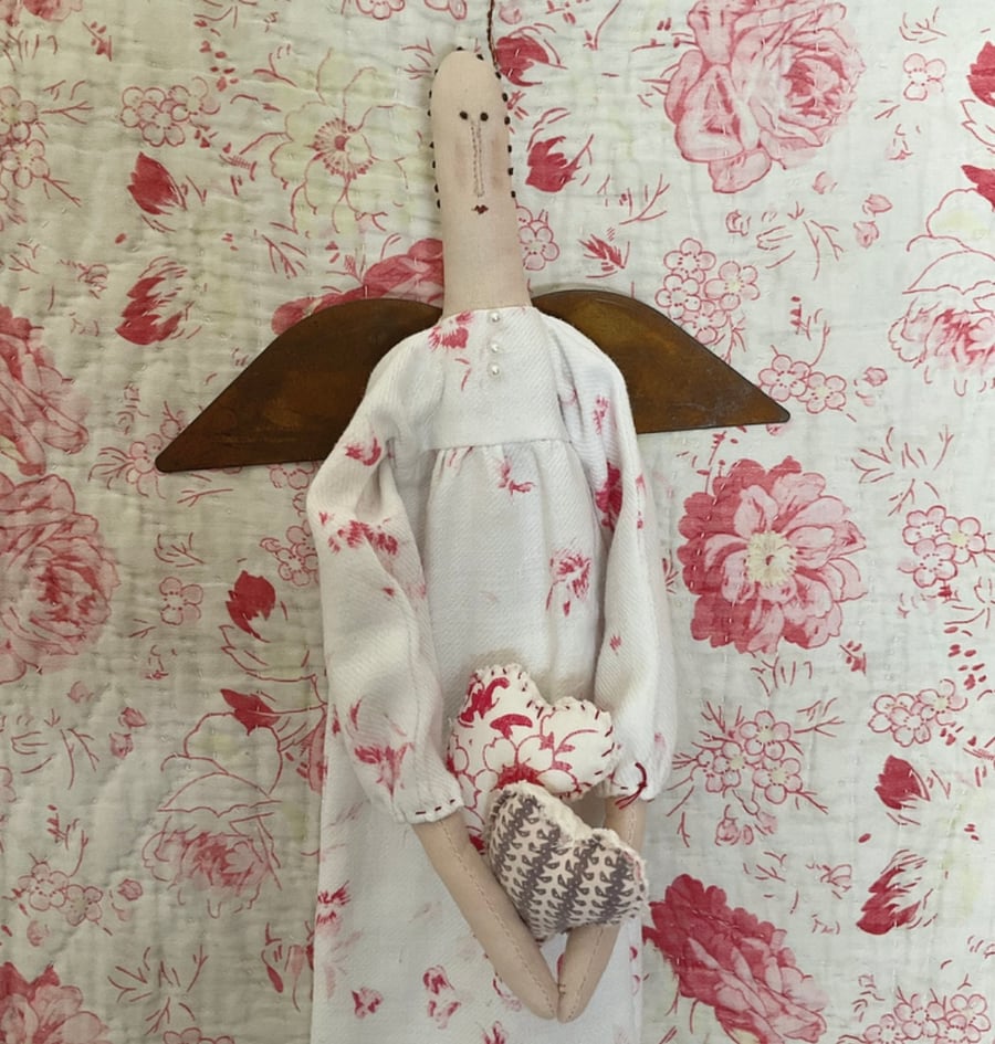 Primitive Angel with hearts