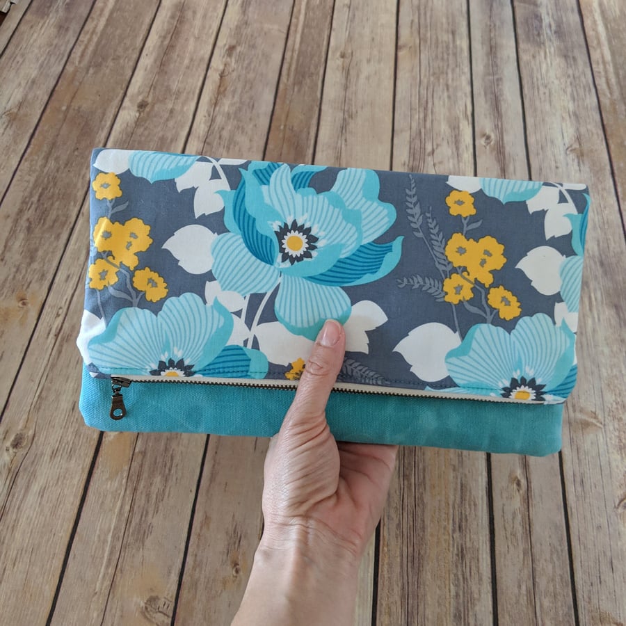 Waxed canvas clutch purse with pretty floral fabric