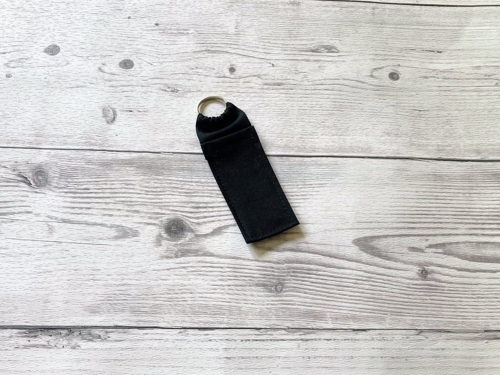 Plain black cotton fabric lip balm holder keyring. Lipstick holder.