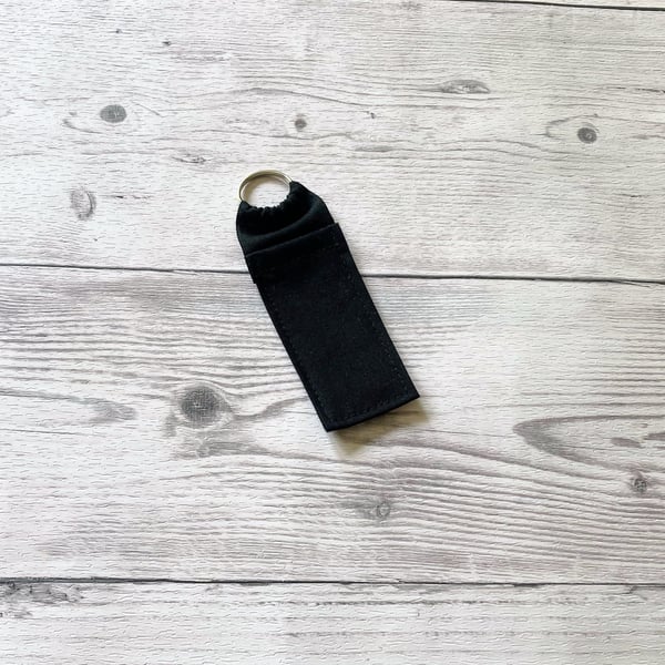 Plain black cotton fabric lip balm holder keyring. Lipstick holder.