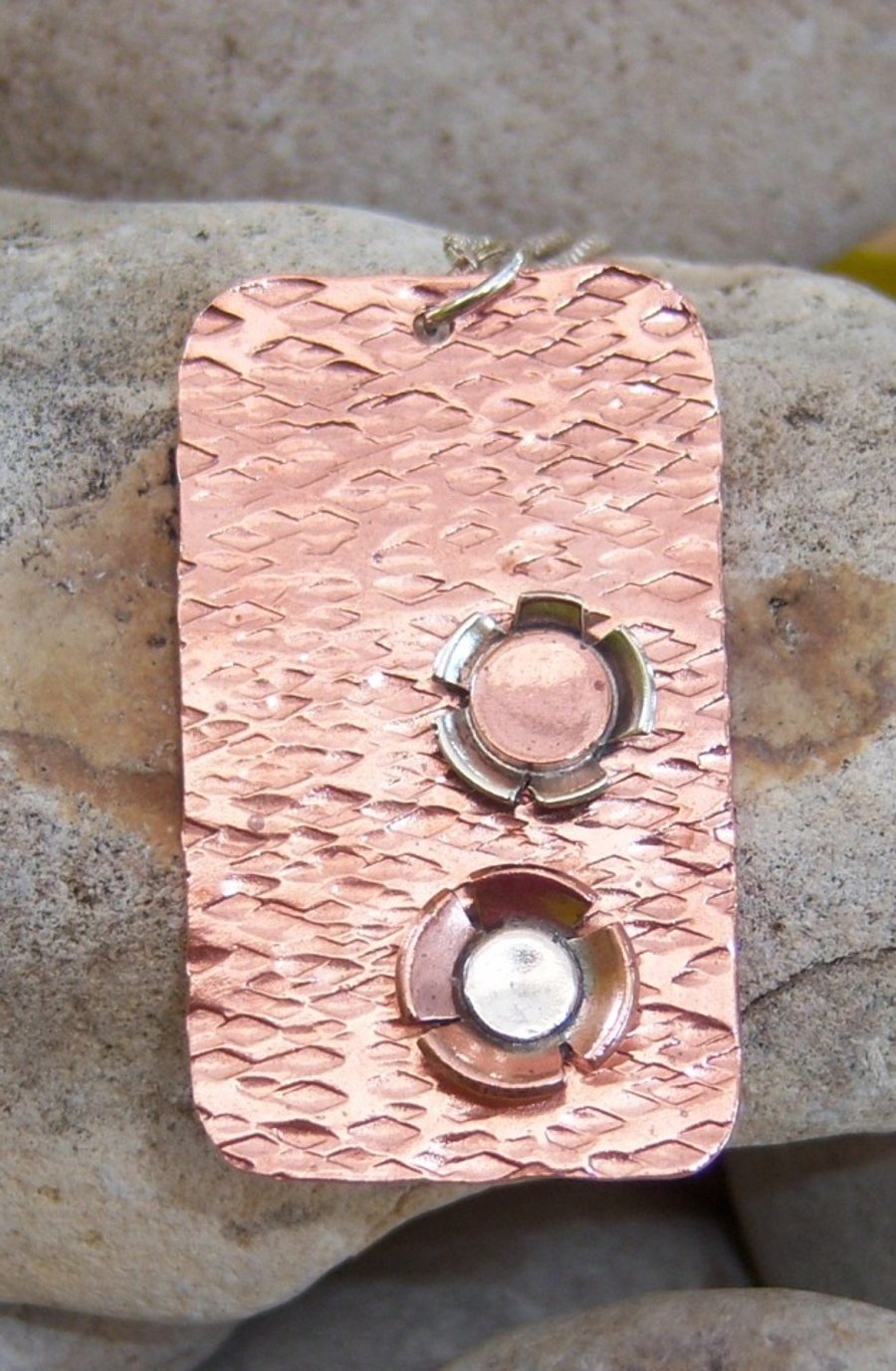 Pendant with copper and sterling silver flowers