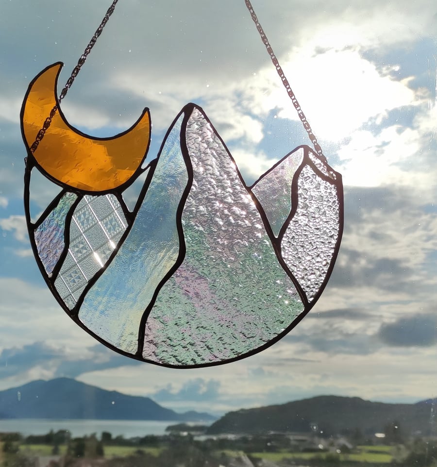 Hand made stained glass panel of the moon and mountains 