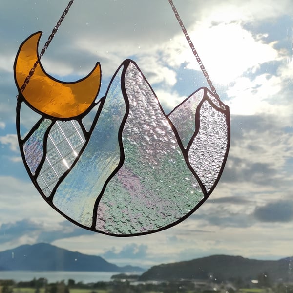 Hand made stained glass panel of the moon and mountains 