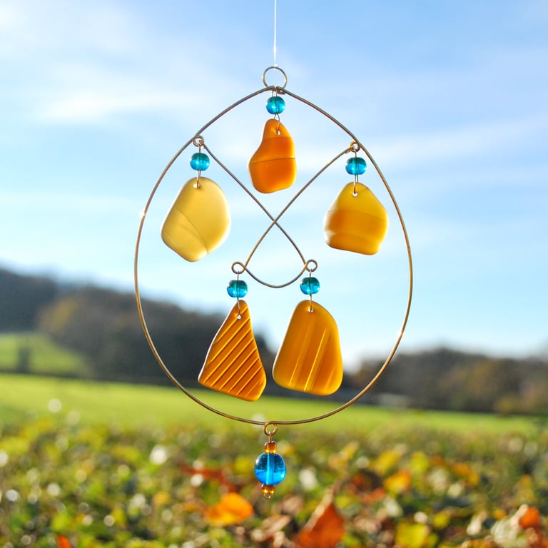 Brown glass sun catcher with turquoise beads