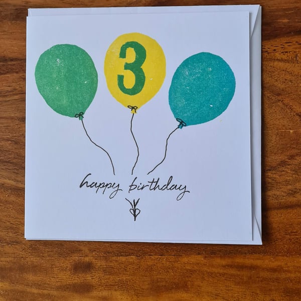 Numbered balloon birthday card handprinted yellow green blue