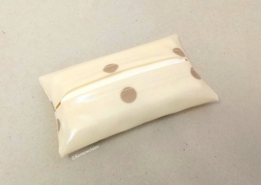 Tissue holder in cream with tan spots, tissues included.