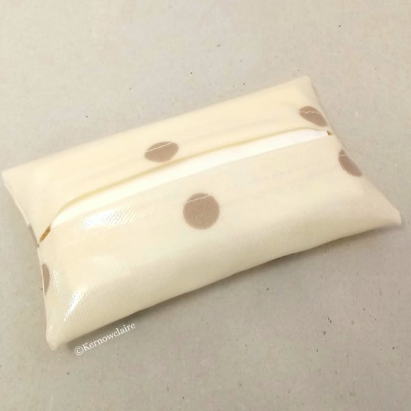 Tissue holder in cream with tan spots, tissues included.
