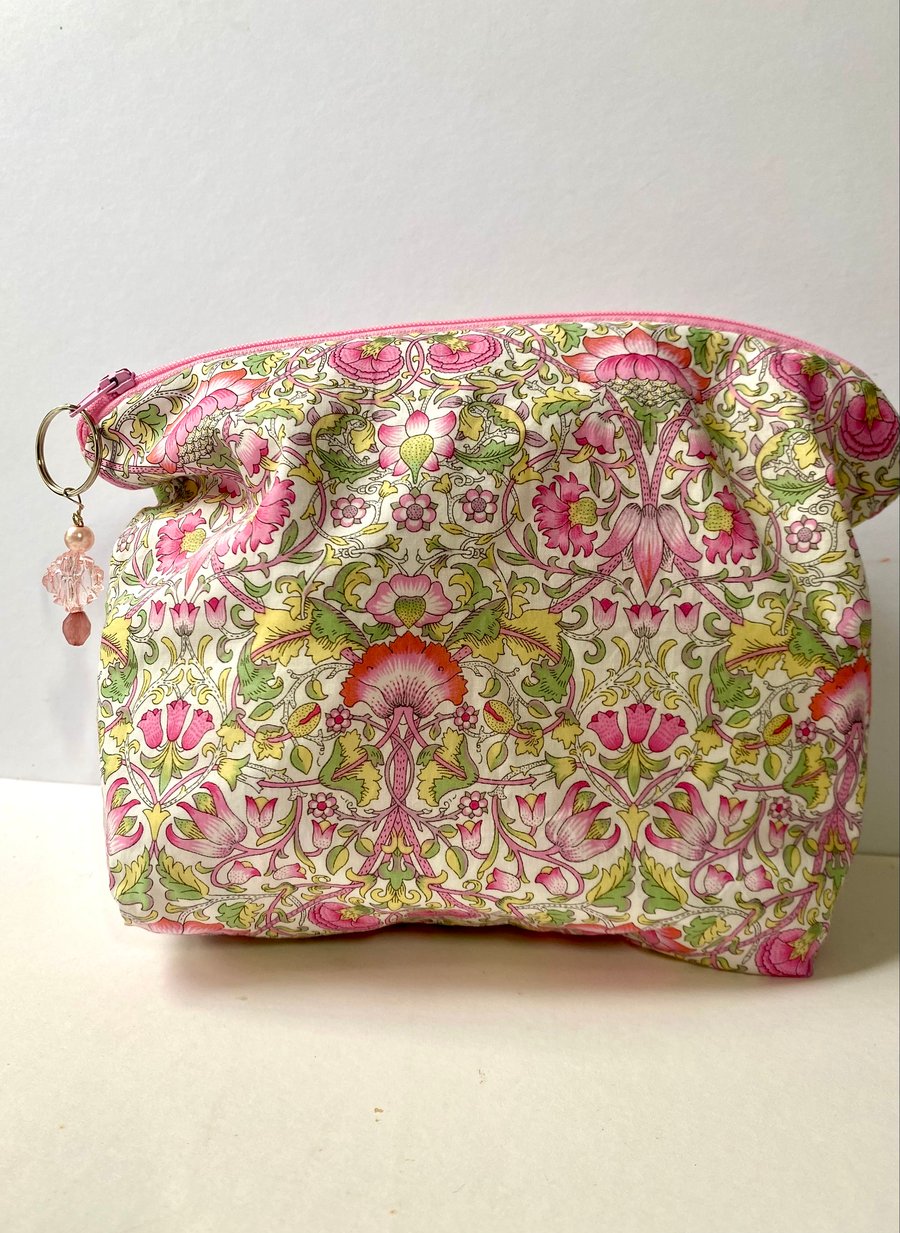 Liberty print cotton lawn cosmetic bag with zip fastening.