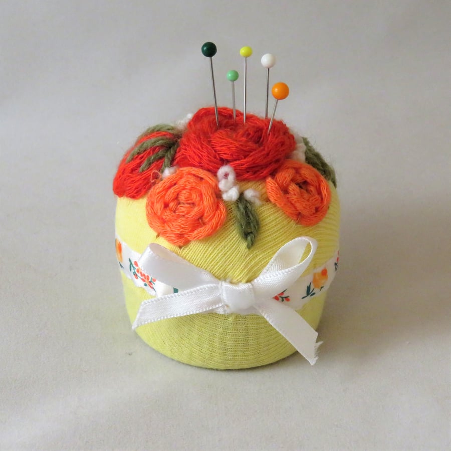 Roses Pincushion from recycled fabric and a bottle top.