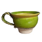Ceramic wheel thrown Green and Yellow Lipped Round Huggable mug .