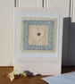 Hand-stitched miniature embroidery worked on heart mounted on greeting card