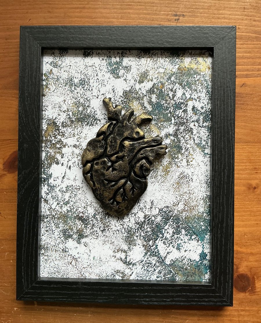 Framed anatomical heart.