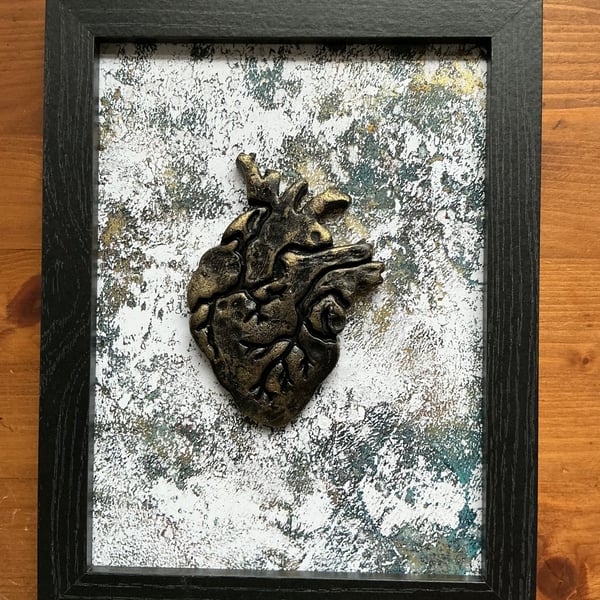 Framed anatomical heart.