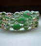 SHADES OF GREENS AND CREAM LAMPWORK BEAD BRACELET.  575 - Image 1