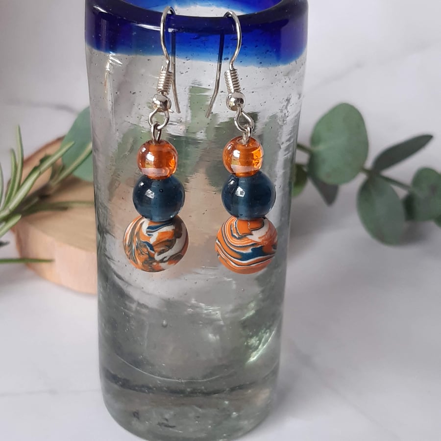 Dangly earrings in navy, orange and white  