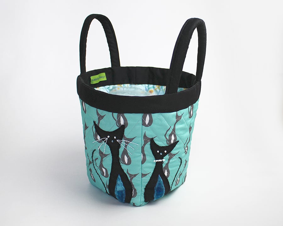Turquoise project bag with appliquéd cats on cat print
