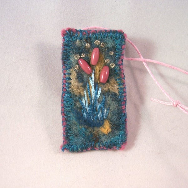Felted and hand embroidered necklace with beads
