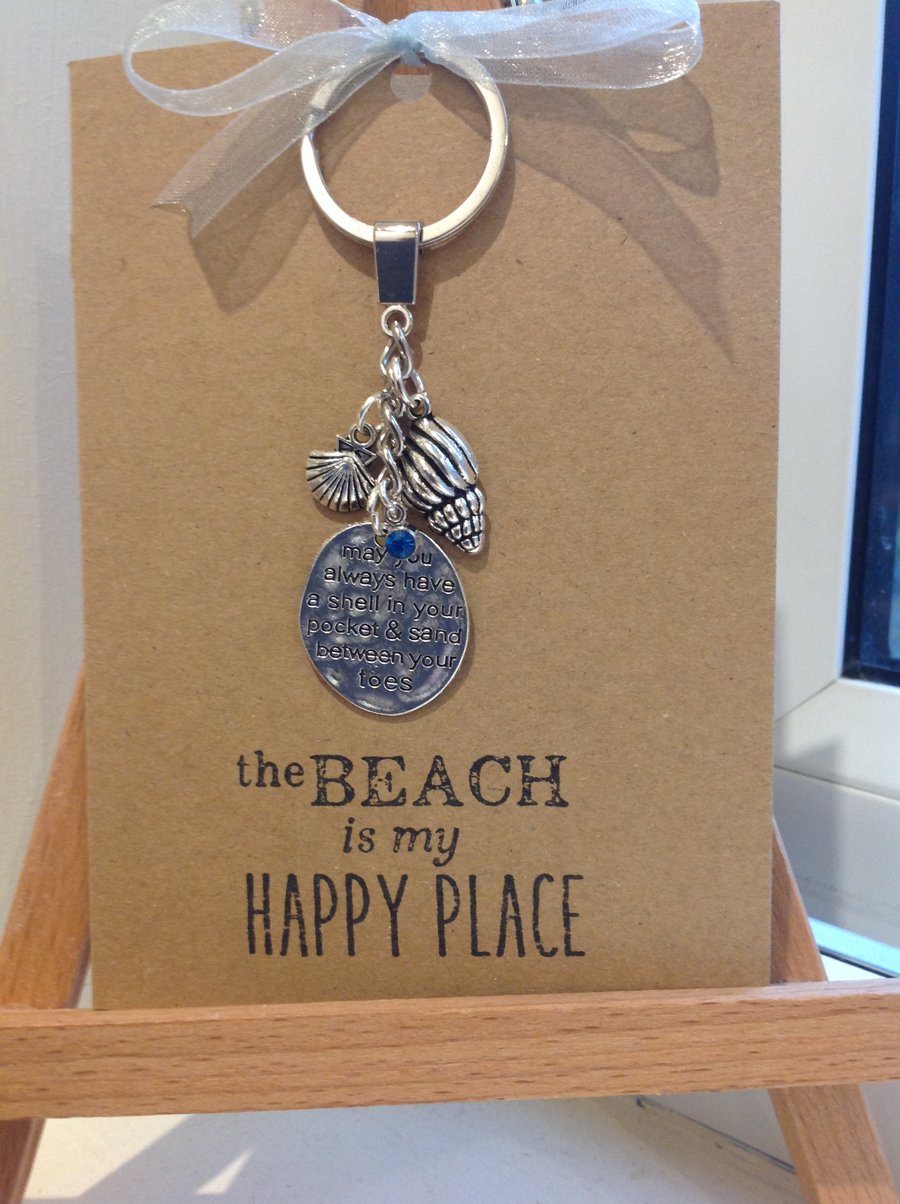 Seashell themed keyring attached to a Kraft greetings card