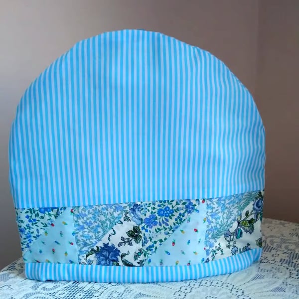 Blue tea cosy with Patchwork border. Tea pot cover
