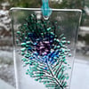 Fused glass lightcatcher with peacock feather