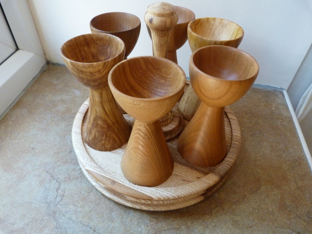 EGG CUP SET, SIX EGG CUPS  IN ENGLISH HARDWOODS ON THERE OWN BASE