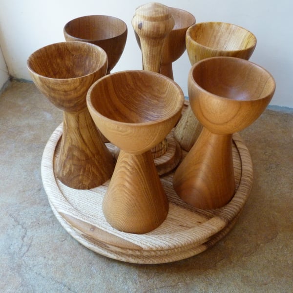 EGG CUP SET, SIX EGG CUPS  IN ENGLISH HARDWOODS ON THERE OWN BASE