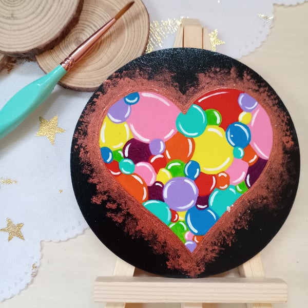 Wooden circular painted heart with easel