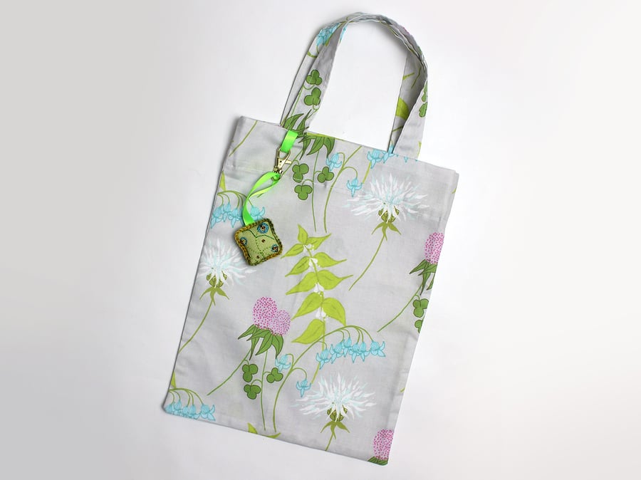 Dead nettle print tote bag with hand embroidered bag charm