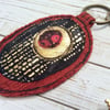 Embroidered upcycled Klimt style key ring of bag charm. 