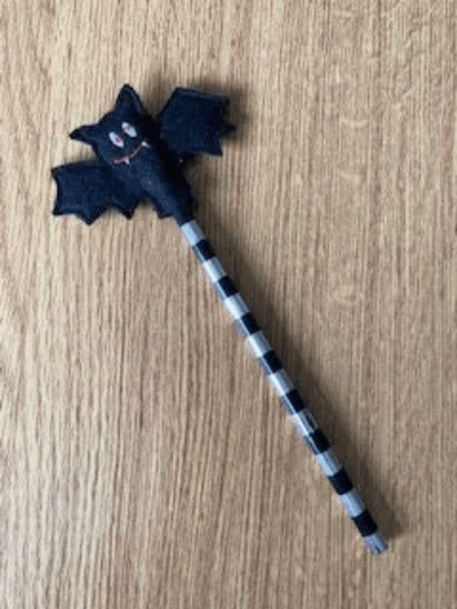 241. Bat pencil topper.